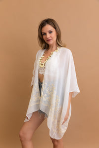 Sophisticated embroidered white kimono with detailed floral pattern.