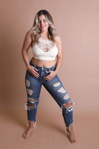 Stretchy ivory plus size lace bralette with cross-back straps.